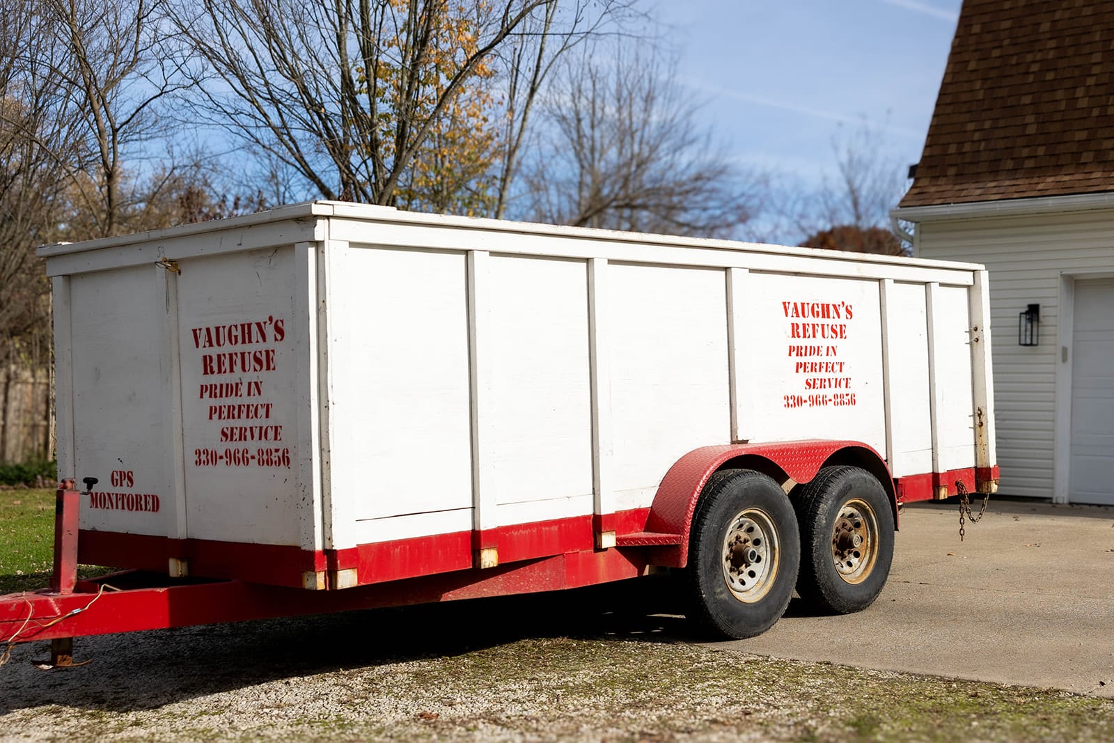 Vaughn's Refuse dumpster parked in driveway of customer in Canton, Ohio.