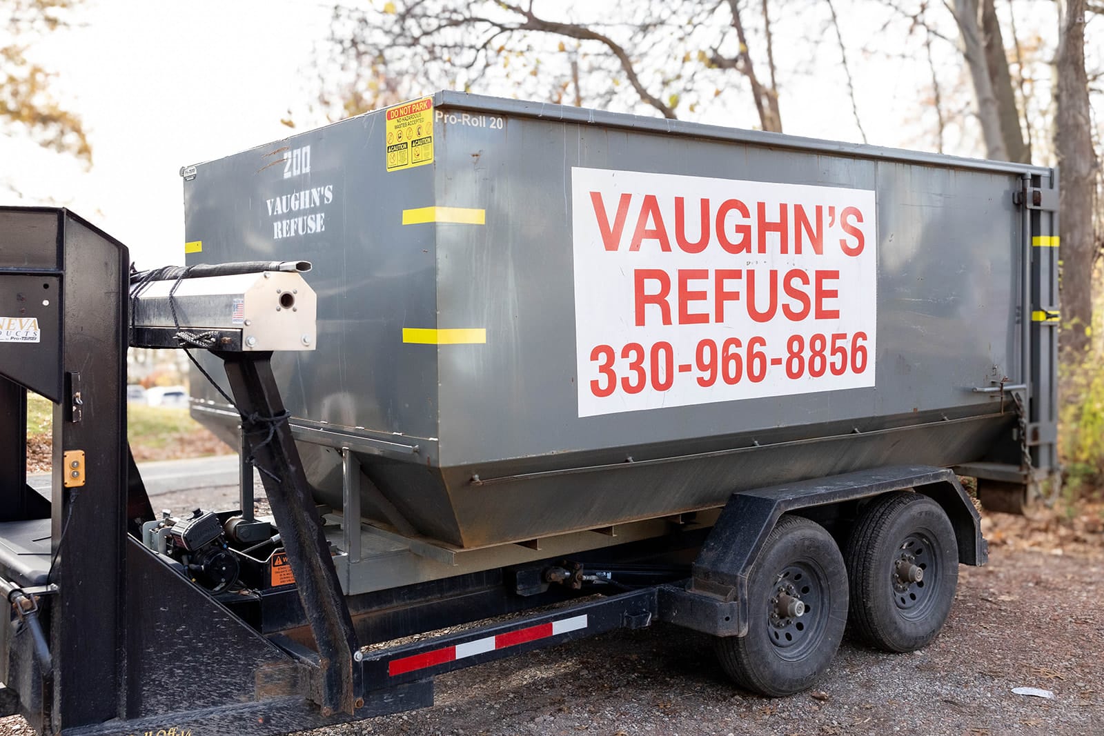 20-yard dumpster on the back of a delivery truck.